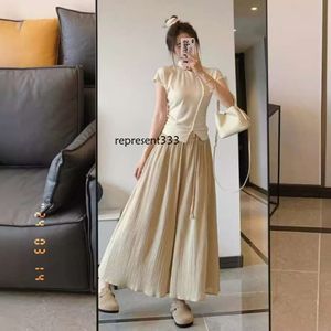 klänningar Ny kinesisk stil oregelbunden smal passform kortärmad t-shirt topp hög midja casual wide ben kjol byxor tvådelar för sommaren