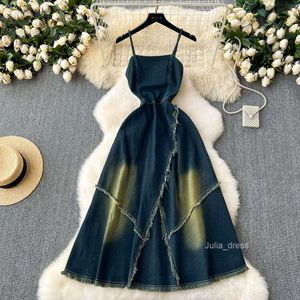 A distressed denim camisole dress for women with a design sense that is niche with a slim waist and a slim temperament. A strapless tassel camisole dress
