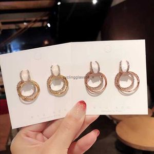 2024 925 Brincos de anel de agulha de prata East Gate Novo estilo Elegante Trendência criativa para mulheres de ponta alta versátil