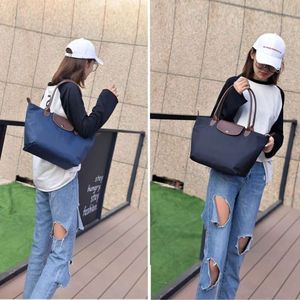 2024 Designer Handväska Ny stor kapacitet Klassisk Tote Bag Foldning Designer Fashion Casual Shoulder Bag Women High Quality Nylon Handväskor SAC