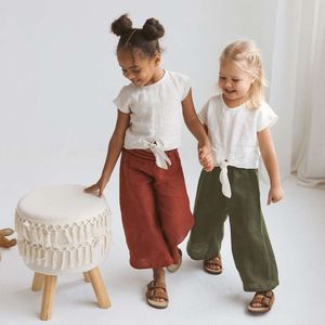 Bawełniana retro i luźne spodnie dla dziewcząt letnie nowe dziecięce elastyczne talia unisex lniane spodnie TZ422 L2405