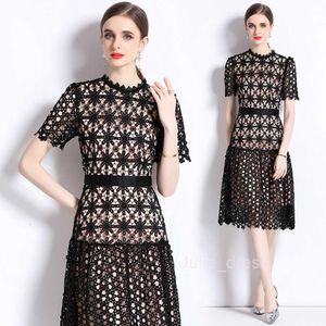 Summer new French round neck short sleeved waist slimming black lace goddess style ruffled edge dress for women