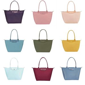 2024 Designer Handväska påse 70 -årsjubileum Handväska Tygväska Singel axel dumplingspåse Underarm Nylon Bag Folding Bag