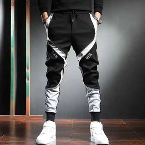 Calça masculina clássica de rua clássica Hip Hop Homem letra de letra Fita de carga bolsos rastrear calças masculinas casuais táticas Sorto K181 Q240529