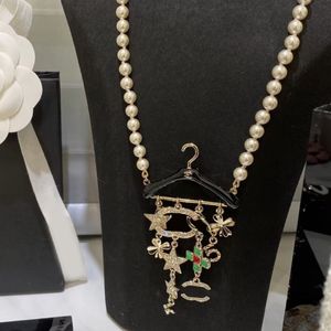 Cadeias de pérolas de colar de diamante letra de letra de pingente de marca de marca 18k Copper Flor Star Pingents Men Womens Wedding Jewelry Gifts