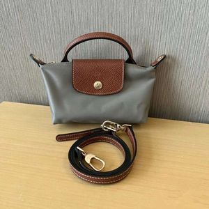 2024 Designer Handbag Mini Fashionable Dumpling Bag Versatile Handheld Large Capacity Storage Makeup Small Bag Womens Single Shoulder Oblique Straddle Phone Bag