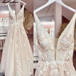 Vintage V-ringning tyll bröllopsklänning 2022 ärmlös spets brudklänningar sexig backless öppen rygg robe de mariee lakshmigown