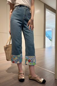 The leg of the 2024 summer collection is embroidered denim jeans with heavy industry halo dyed flower beads