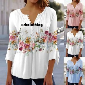 T-Shirt 2023 Frühlings-/Sommermode Neue Frauenblumendruck V-Ausschnitt Kurzarm gepresstes Faltenknopf-T-Shirt mit unten