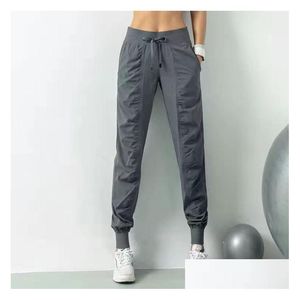 Yoga outfit kvinnor jogging byxor Lossa Sweatpants Womens Fitness Sports Joggers Running Stretch Slant Feet Sweat Drop Delivery Outt OT4Q8