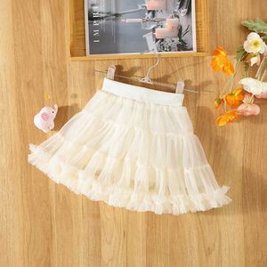 تنورات الصيف الجديدة Girls Baby Skirt Mesh Pommel مطوية اللون الصلبة الحلو الأميرة كلها مؤيدة للتشويه الرياح H240530 FG0B