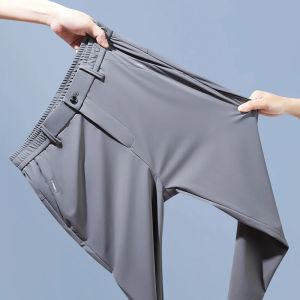 Wiosenne lato męskie spodnie Casual Business Slim Slim Fit Elastyczna pasa jogger koreańskie klasyczne cienkie czarne szare spodnie