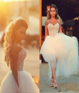 Corset Top Wedding Dresses 2019 Beaded Pearls High Low Tulle Summer Beach Country Brudklänningar Saudiarabiska lyx Modest8316014