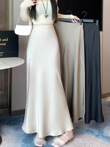 Letnia satynowa spódnica 2024 damska jedwabny jedwabny wysoki mody koreański solidny szampan czarne spódnice midi dla kobiet 240530