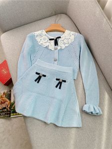 2024 Summer Blue Two Piece Dress Sets Long Sleeve Round Neck Bow Knitted Single-Breasted Top + Short Mini Skirt Set Two Piece Suits Y4W313097