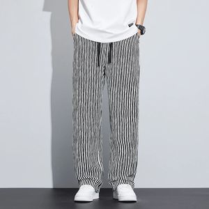 Spring Summer Stripe Casual Pants Mężczyźni noszą luźne proste szerokie nogę Elastyczne spodni jogger spodni Male Streetwear 240531