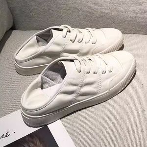 Wearing two pairs of genuine leather small white shoes women's summer thin version can be stepped on with flat bottomed casual shoes new model