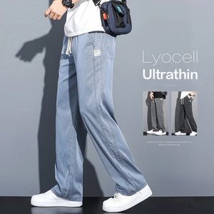 Letnie miękkie lyocell tkaniny dżinsy cienkie luźne spodnie proste sprężyste talia Korea swobodne spodnie plus m-5xl 240325