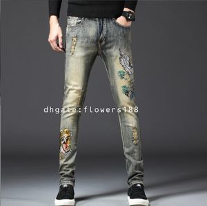 Jeans masculinos Novos jeans de jeans masculinos Bordados Cabeça Tiger Slim Fashion Fashion Boys Purple Jeans Boys Ripped Jeans Boys Skinny Jeans Brown Jeans