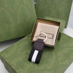 Chaves de fanfeta de metal de fita de fita para homens e mulheres designer de luxo Keychain cordão