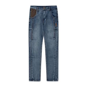 Solidne streetwearne moda niebieska dżins Slim Elaste Haft panel rozciąganie Slim Fit Spoders Spodnie rozciąganie kamiennego mycia Proces rozrywających dżins