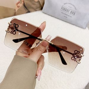 2024ファッションデザイナーサングラスメンクラシックメタルフレームレスサングラスラグジュアリー女性サングラスUV保護眼鏡