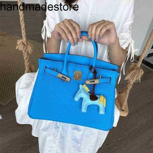 BK Platinum Leather Designer Handbag Baotou Layer Cowhide Litchi Mönster Izmir Blue 2024 Portable One Shoulder Diagonal Trendy Womens Bag