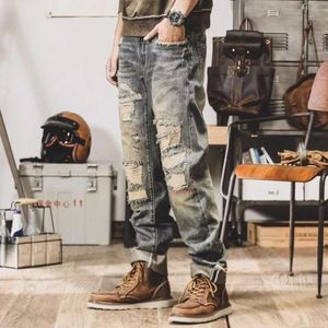 Temperamento alla moda, stile americano, jeans pesanti artigianali, gamba dritta ampia da uomo, abiti da lavoro a gamba larga traforati, pantaloni casual da mendicante