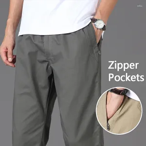 Pantaloni da uomo maschi casual con tasche con cerniera cotone di alta qualità 2024 estate autunno stretumplable waist sports work