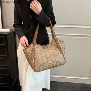 Designer de bolsa de ombro American Classic Style Impresso Saco para mulheres 2024 Nova moda Tote de grande capacidade versátil Compras casuais Um computador de mão