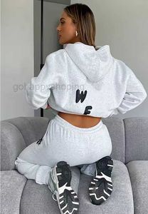 Traccettaci da donna Women Hoodie 2 Fedette di outfit pullover Spacchi sporti Pantaloni bianche con cappuccio a maniche lunghe