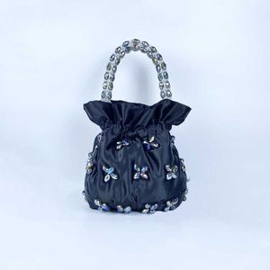Handwoven acrylic beaded bag, fairy handbag, triangle wrist bag, trendy and fashionable women's bag 240402