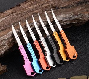 7 färger nyckelform mini folding kniv utomhus sabel fickfruktkniv multifunktionell nyckelring knivar schweiziska självdefenskniv ou8977731