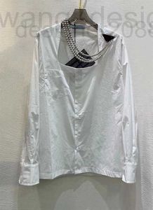 女性用ブラウスシャツデザイナートップ2023早春ニューラインシンプルな気質大型UネックリムーバブルビーズストリングネックレスシャツQBMP G12A