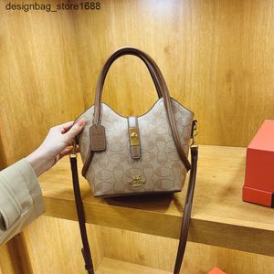 Umhängetaschen Designer American Classic Style High -End -Boutique -Eimer für Frauen 2024 Neue bedruckte Handtasche lässig und vielseitig einzelner Schulterkreuzbody