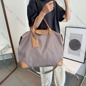 2024 TOTE BAM di grande capacità per le vacanze BASSE DA PARTE DONNA DUFLE BASSO NUOVA SANGGE NYLON BAG BAG BAGGI GUAGI