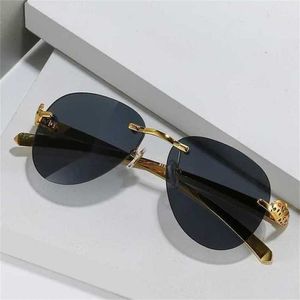 高品質のファッショナブルサングラス10％オフ高級デザイナーNew Men's and Women's Sunglasses 20％オフカードメタルフレームレスヒョウヘッドファッションヒキガ