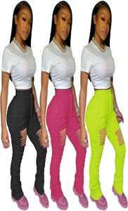 Kvinnor PS -storlek designer rippade en bit sportbyxor spring casual klädfold capris split byxor fasta färg leggings hål dhl 28778871614