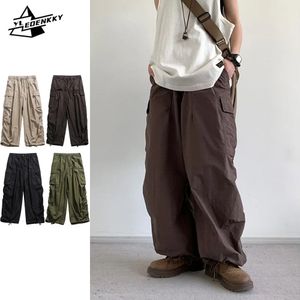 Överdimensionerade lastbyxor män kvinnor hip-hop multi-pocket bredbensbyxor vintage lösa casual pantaloons vårpar unisex byxor 240402