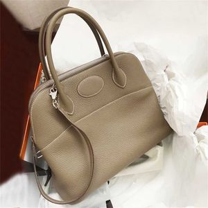 High definition leather designer bag style Bowling Bag Baolai bag Togo lychee grain head layer cow leather portable one shoulder slanting shell bag womens bag