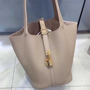 Borsa di design in pelle ad alta definizione Guangzhou Casa di litchee per cesto vegetale cesto vegetale in pelle vera in pelle piccole tino vano in pelle semplice e versatile