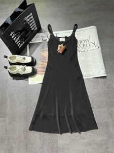 Early Spring New Miu Nanyou Sweet and Spicy Style Big Design Slim Versatile on the Body, Slippery Strap Small Black Dress