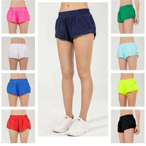 2024 Lululemens Womens Yoga Hot Athletic Yoga Pants Elastic Waistband Running Shorts Pocale Pocengio Atletico Culletto per esterno Shorts di allenamento sportivo JG668