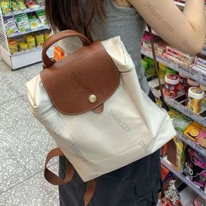 2024 Nowa nylonowa torba na ramię kobietę Koreańska torebka rekreacyjna Klasa studencka Klasa duża pojemność Kontrastujące kolory plecak 1as AZ