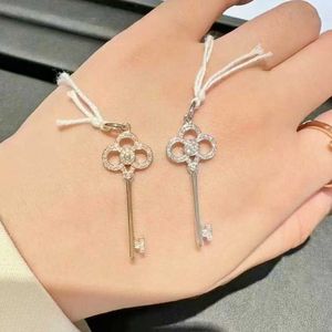 Designer Brand High version V-gold Tiffays key necklace for womens fashion with diamond sunflower pendant crown iris collarbone sweater chain