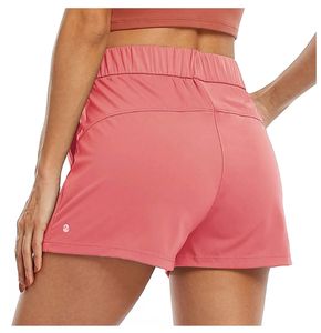 Kvinnors yogakortkläder med träning Fitness Wear Short Pants Girls Running Elastic Pants Sportwear Pockets