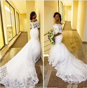 Vintage fora do ombro Mermaid Vestido de noiva 2017 Apliques de renda Veja através de vestidos de noiva africanos árabes com mangas curtas1461444