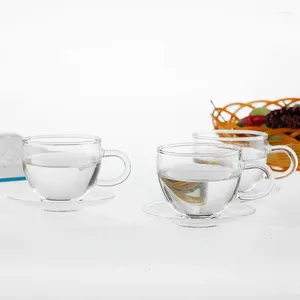 Koppar tefat tekoppar och tefat sätter värmebeständigt klart kaffe te