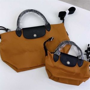 Retail Wholesale 95% Off hobo bag Nylon 2024 Small luxury Dumpling Womens High Fabric with Cowhide Casual Crossbody Youth Quality Shoulder Handbag hobo