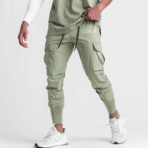 Summer Mens Casual Fashion Simple Nine-Point Pants Lose Sweatpants Ultra-tunna midjbyxor gjorda i Pakistan